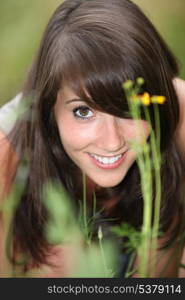 Woman kneeling in the grass