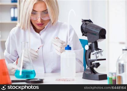 Woman lab analyst working on new drugs