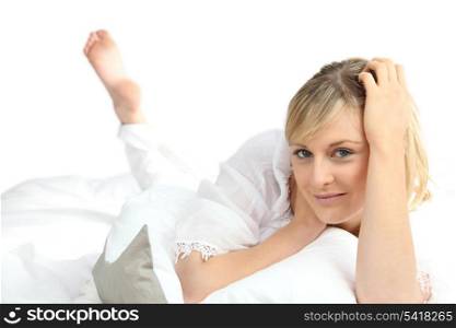 Woman laid on her bed