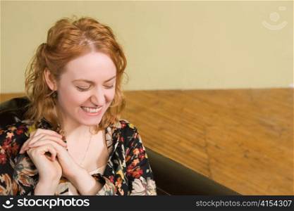 Woman Laughing on Couch