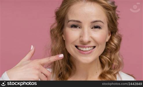 woman laughing pointing her smile 2