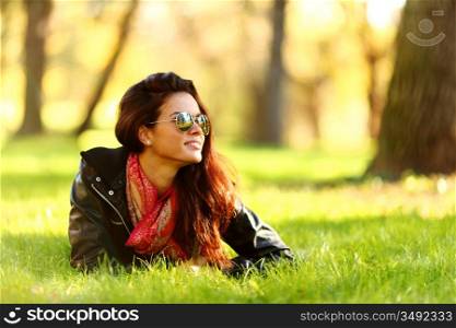 woman lay on green grass in park