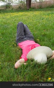 Woman laying down in meadow