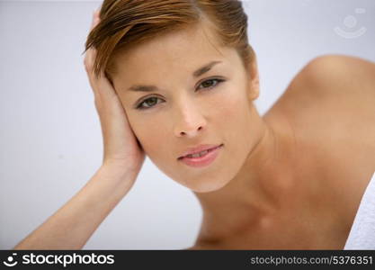 Woman laying dressed only in towel