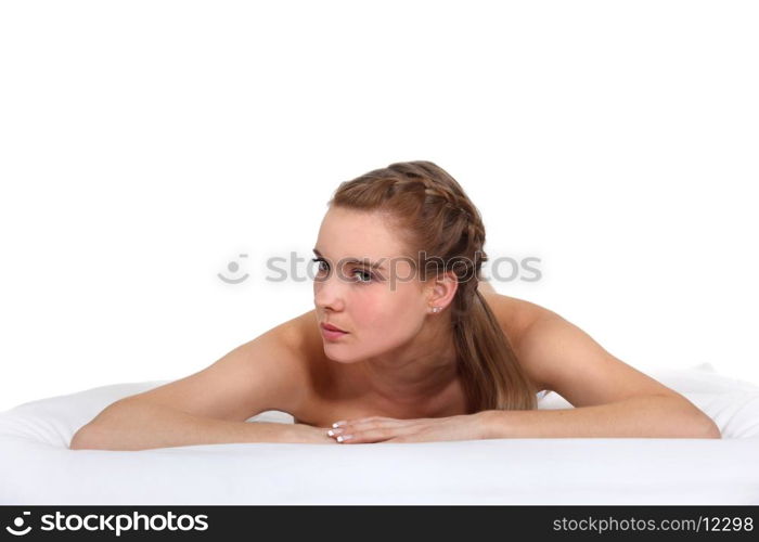 Woman laying naked in studio