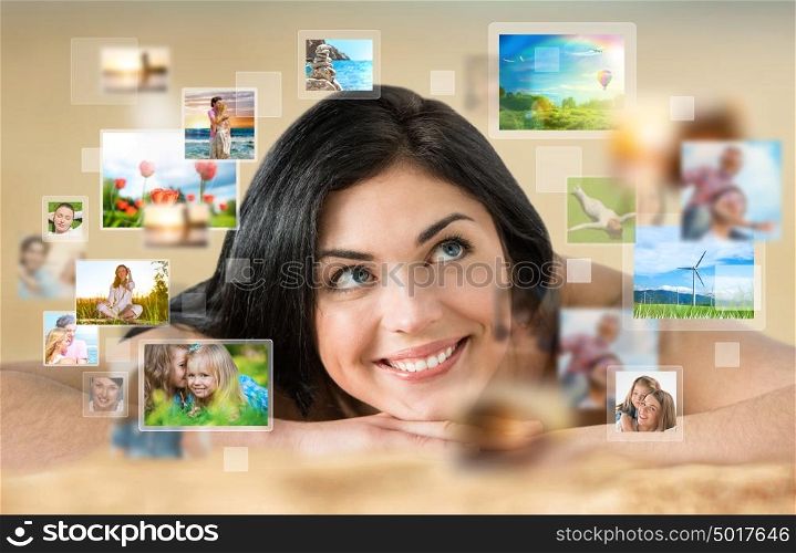 Woman laying on beach with lots of pictures around her. Cloud storage service, online sharing concept