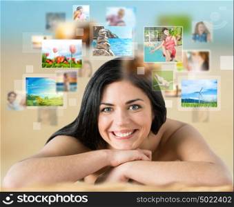 Woman laying on beach with lots of pictures around her. Cloud storage service, online sharing concept