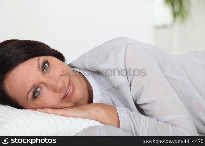 Woman laying on cushion