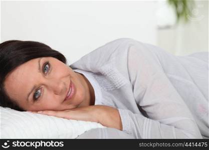 Woman laying on cushion