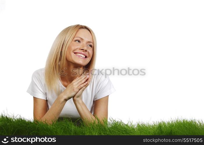 Woman laying on grass, isolated on white background