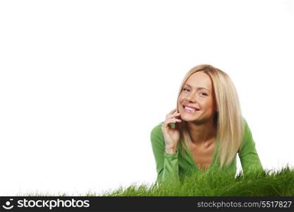 Woman laying on grass, isolated on white background