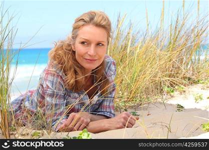 Woman laying on the sand