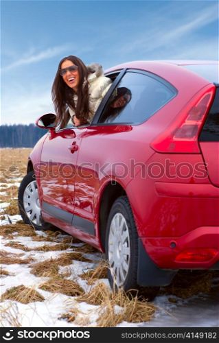 woman lean out of her car
