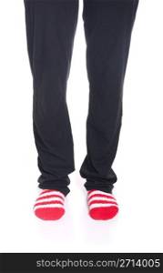 woman legs in pyjamas with red socks on white background