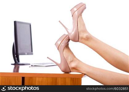 Woman legs on the desk