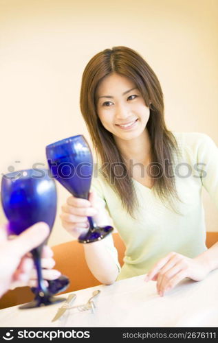 Woman lifting a glass