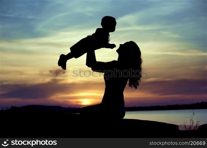 Woman lifting up her little child
