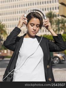 woman listening music headphones 2
