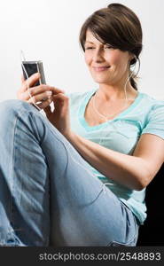 Woman listening to mp3 player