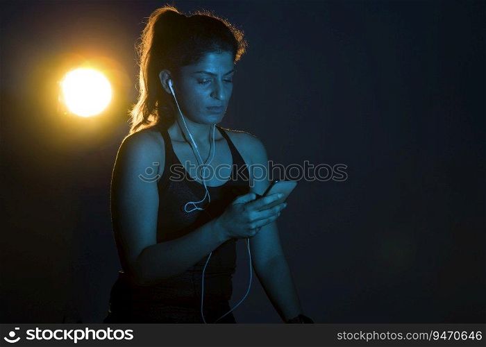 Woman listening to music after a workout. 