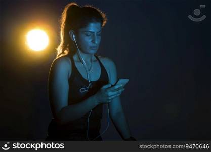 Woman listening to music after a workout. 