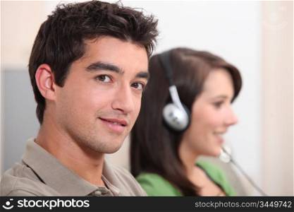 Woman listening to music next to her boyfriend