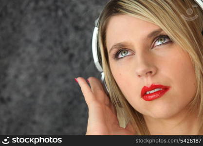 Woman listening to music on headphones