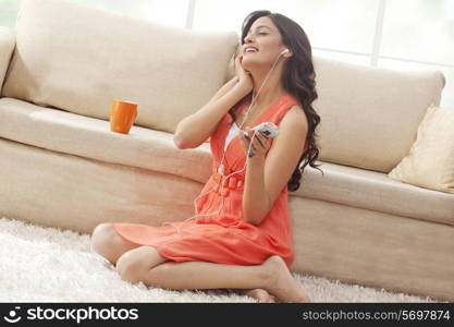 Woman listening to music on her mobile phone