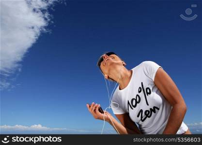 Woman listening to music outdoors