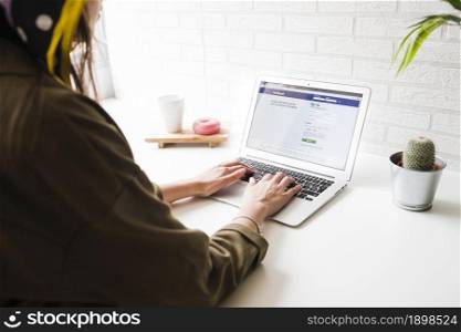woman login into facebook website laptop. Resolution and high quality beautiful photo. woman login into facebook website laptop. High quality beautiful photo concept