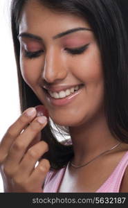 Woman looking at a grape