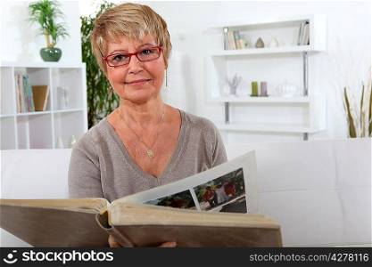 Woman looking at a photo album