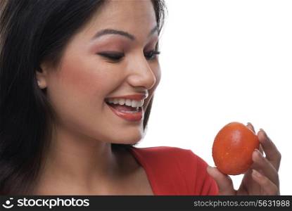 Woman looking at a tomato