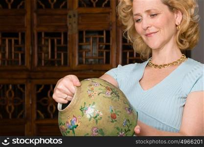 Woman looking at a vase