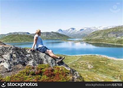 woman looking at fjord in NOrway