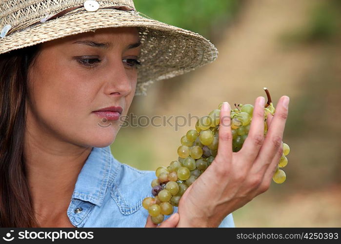 Woman looking at grapes