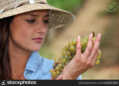 Woman looking at grapes