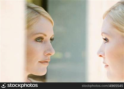 Woman looking at her reflection