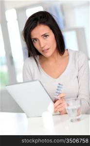 Woman looking at medicine dosage on internet