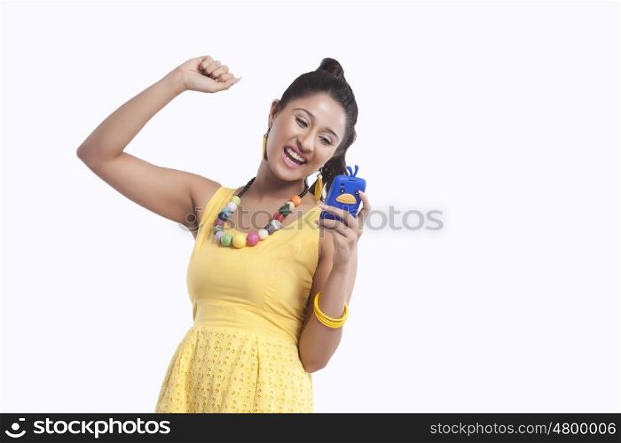 Woman looking at mobile phone and rejoicing