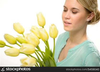 Woman looking down yellow tulip spring flowers isolated on white