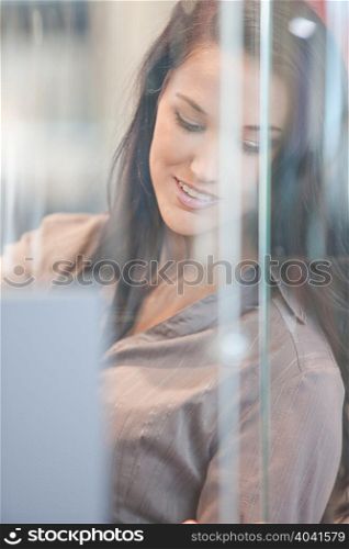 Woman looking in glass case