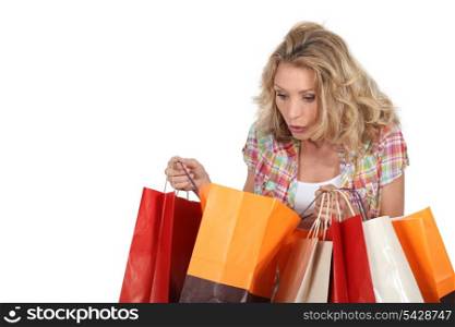 Woman looking in shopping bags