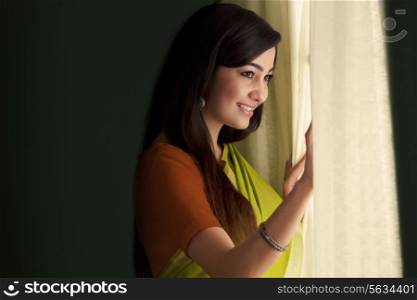 Woman looking out of a window