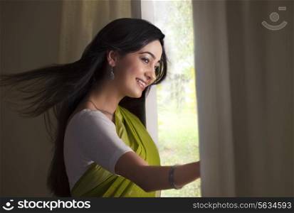 Woman looking out of a window