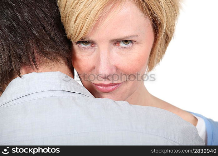 Woman looking over man&acute;s shoulders