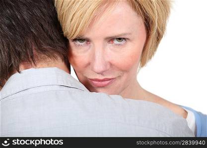 Woman looking over man&acute;s shoulders