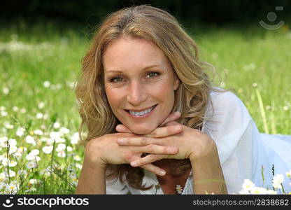 Woman lying in a field