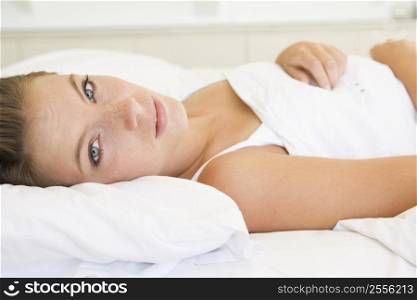 Woman lying in bed