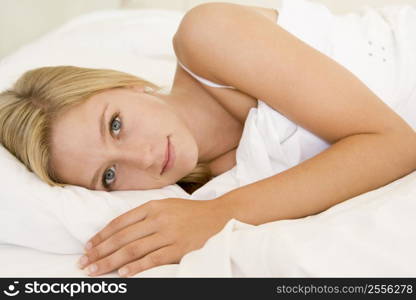 Woman lying in bed